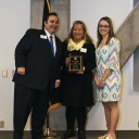 Dr. Jonathon Hyde, dean of students and associate vice chancellor for student affairs, left, poses with Rhonda Brooks Bullock, center, and Celine Bullock, daughter and granddaughter, respectively, of Ronnie L. Brooks, for whom the Ronny L. Brooks Award for Outstanding Leadership is named. Sarah Aldridge, who was not in attendance at the Leadership and Legacy awards ceremony, is the 2018 recipient of the award. Photo by Jeremiah Bradshaw