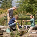 Dr. Shea Tuberty, professor in and assistant chair of Appalachian’s Department of Biology, far left, works with biology graduate students Grant Buckner, of Burnsville, center, and Cristina Sanders, of Taylorsville, to collect water samples from Boone Creek. Their water quality studies are among the many campus research and creative endeavors that address issues or concerns within the High Country area, benefitting the region while providing students with skills that are sought after from both employers and