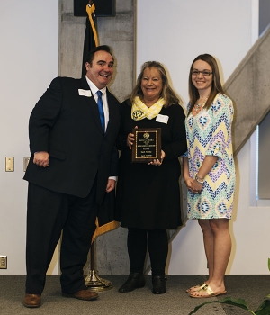 Dr. Jonathon Hyde, dean of students and associate vice chancellor for student affairs, left, poses with Rhonda Brooks Bullock, center, and Celine Bullock, daughter and granddaughter, respectively, of Ronnie L. Brooks, for whom the Ronny L. Brooks Award for Outstanding Leadership is named. Sarah Aldridge, who was not in attendance at the Leadership and Legacy awards ceremony, is the 2018 recipient of the award. Photo by Jeremiah Bradshaw