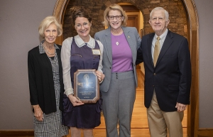 Dr. Martha McCaughey, director of Appalachian’s First Year Seminar program and professor of sociology, second from left, holds the plaque she received as part of her 2019 Harvey R. Durham Freshman Advocate Award. Dr. Harvey Durham, for whom the award is named, far right, his wife, Susan Durham, far left, and Appalachian Chancellor Sheri Everts, second from right, presented McCaughey with the award after a breakfast held at the Appalachian House in April. Photo by Marie Freeman