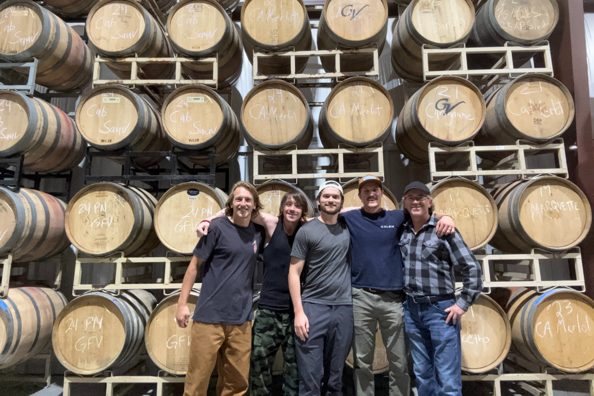Fermentation Sciences majors Finn Adams (left), Chris Martin (second from left), and Dominic Bernardi (third from left) learned about winemaking from Will Burrow ’20 (fourth from left), head winemaker at Grandfather Mountain Vineyard in Banner Elk.