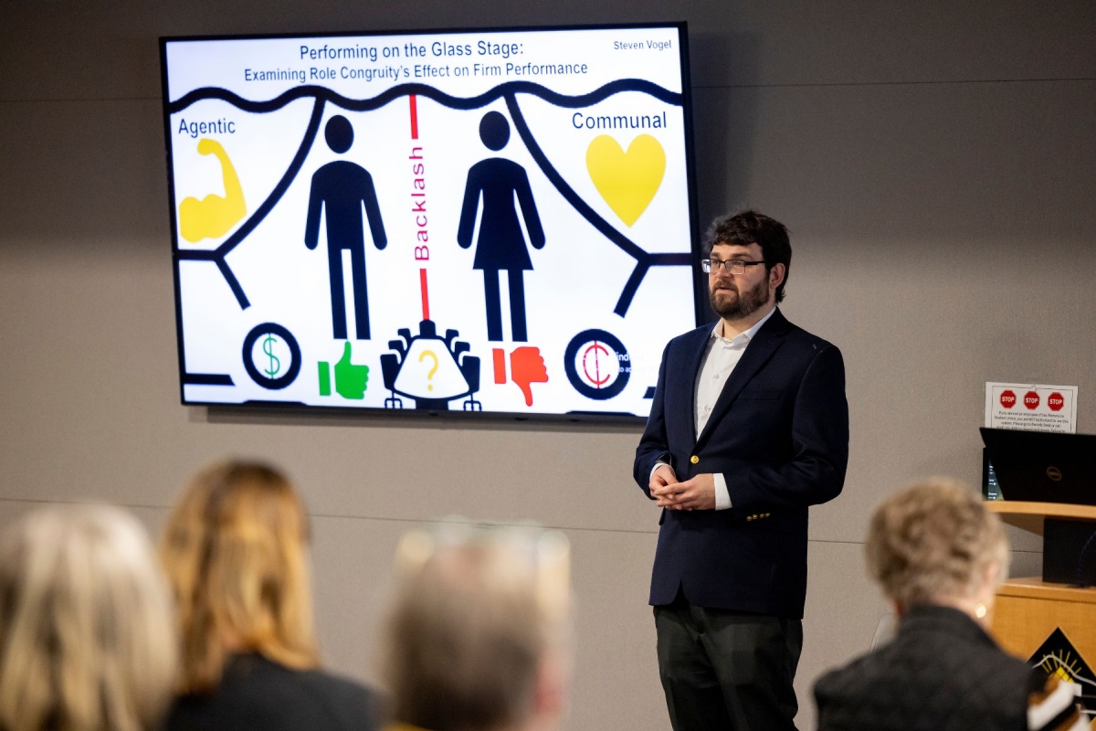 Steven Vogel, a second-year graduate student in the Industrial-Organizational Psychology and Human Resource Management program, presents "Performing on the Glass Stage: Examining Role Congruity’s Effect on Firm Performance" during the final around of the 13th annual Three Minute Thesis competition on Friday, January 24, 2025. Photo by Kyla Willoughby