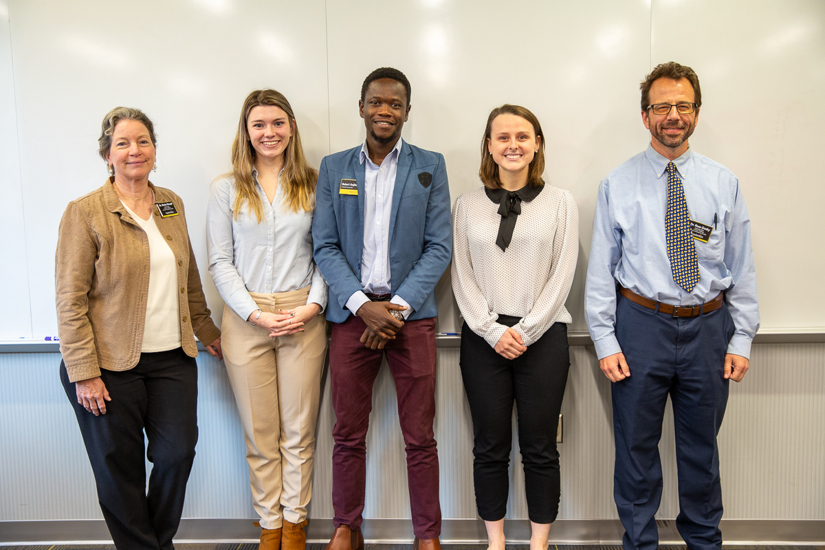 Interim Dean of Graduate Studies Dr. Marie Hoepfl and Interim Associate Dean of Graduate Studies Dr. Ross Gosky with award recipients Skyler Prowten (People's Choice), Robert Onjiko (2nd), and Kelly Davis (1st).