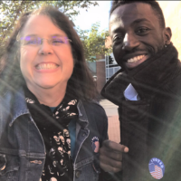 Angela Owen, office manager, Department of Physics and Astronomy, voting on campus with former colleague Christer Akouala. Photo submitted