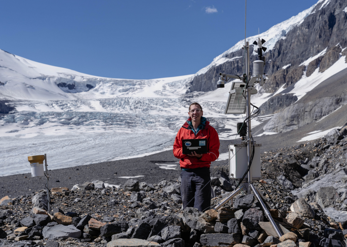 Dr. William Armstrong, assistant professor in Appalachian State University's Department of Geological and Environmental Sciences, servicing a weather station on Athabasca Glacier in Alberta, Canada in 2022. Photo by Zach Montes (Orijin Media)