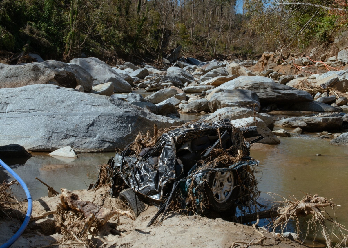 A mangled car in the river near Bat Cave, NC. Photo by Barber (jesse-barber.com)