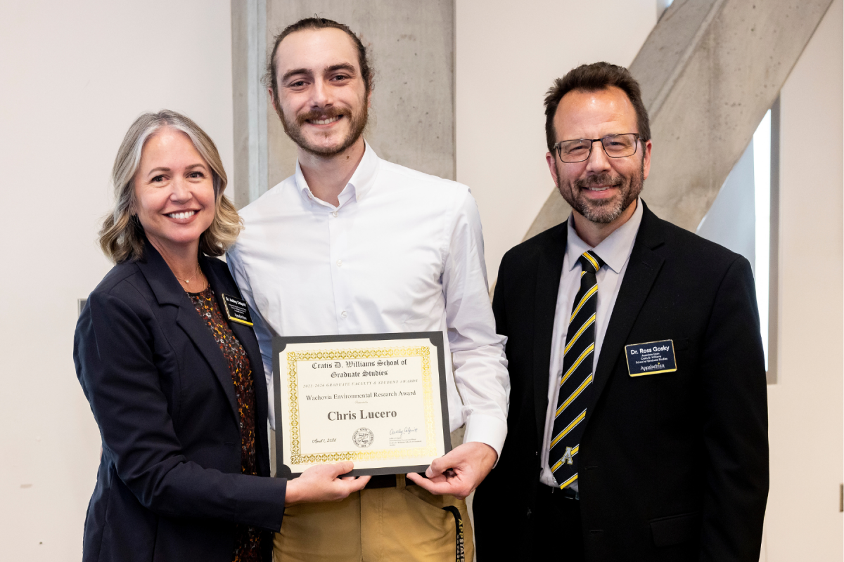 Geography graduate student Chris Lucero &rsquo;24, center, receives the Wachovia Environmental Research Award at the Cratis D. Williams School of Graduate Studies Faculty and Student Awards Ceremony on Tuesday, April 7, 2026. (Photo by Kyla Willoughby)