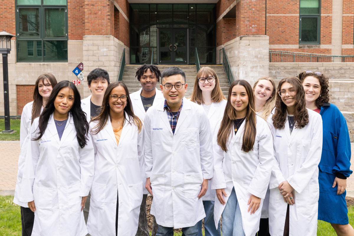 Fighting for a common cause, Daniel Chen cancer lab members, from left to right, (back row): Kelly Beach, Zaw Bring, Brice Griffin, Jenna Spears, Tessa Christner, and Chloe Ledbetter. (front row): Janet Santos-Antonio, Gabriela Gonzalez Caquias, Daniel Chi-Wei Chen, Luiza Dias, and Ava Mendez. Photo by Chase Reynolds