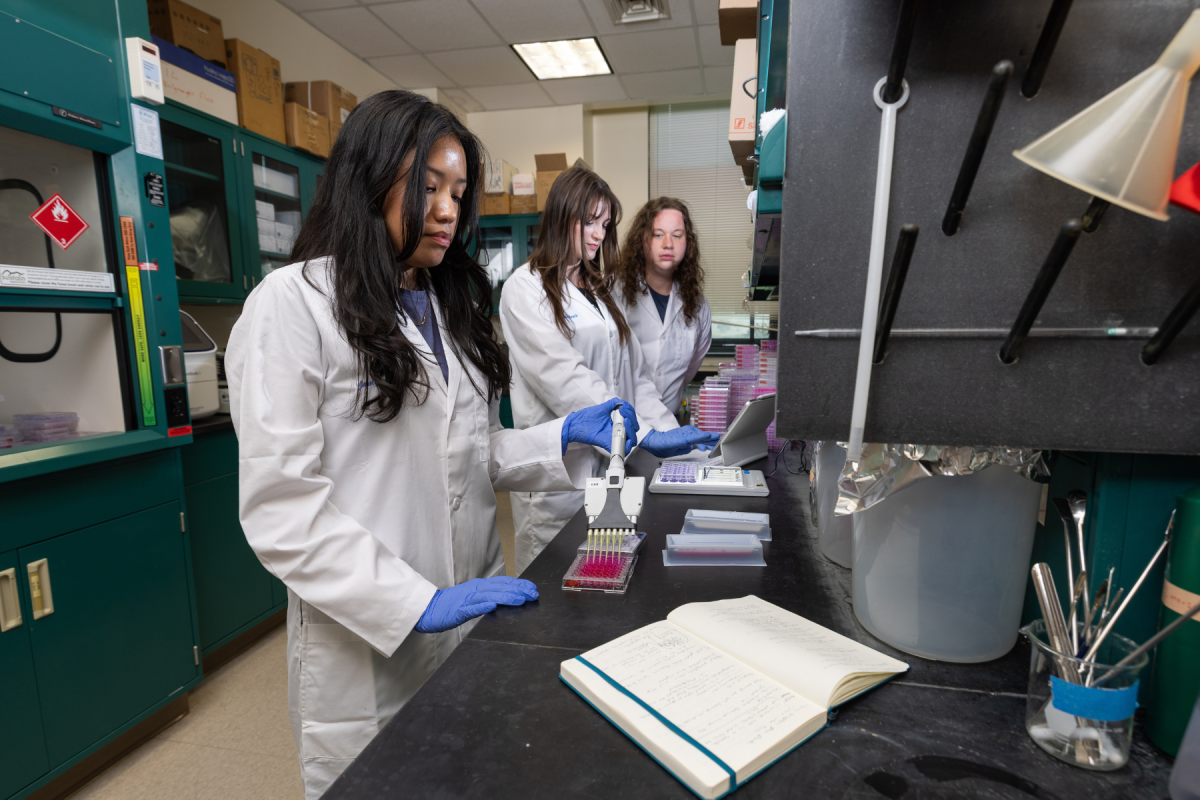 At work in the lab are App State student researchers, left to right, Janet Santos-Antonio, Kelly Beach, and Johnathan Barefoot. Photo by Chase Reynolds