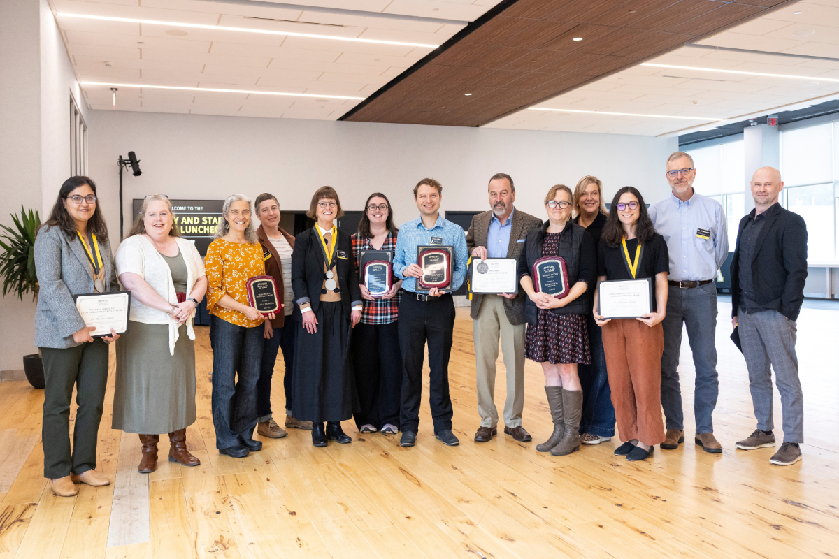 Dr. Roshani Silwal, Dr. Mary Valante, Carla Ramsdell, Dr. Emily Lutenski, Lynn McNeil, Jennifer McGuinn, Shane Miller, Dr. Ozzie Ostwalt, Dr. Katie Mawhinney, Dr. Tracie Salinas, Dr. Johnnie Lotesta, Dr. William Anderson Jr., and Dr. Christopher Bartel at the CAS Faculty and Staff Awards Luncheon on Wednesday, November 19, 2025. Photo by Kyla Willoughby