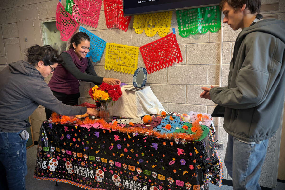 Dr. Yunuen Gomez-Ocampo and students assemble an ofrenda (altar) in L.S. Dougherty Hall for Día de los Muertos (Day of the Dead). Photo submitted by Dr. Karola Rico García
