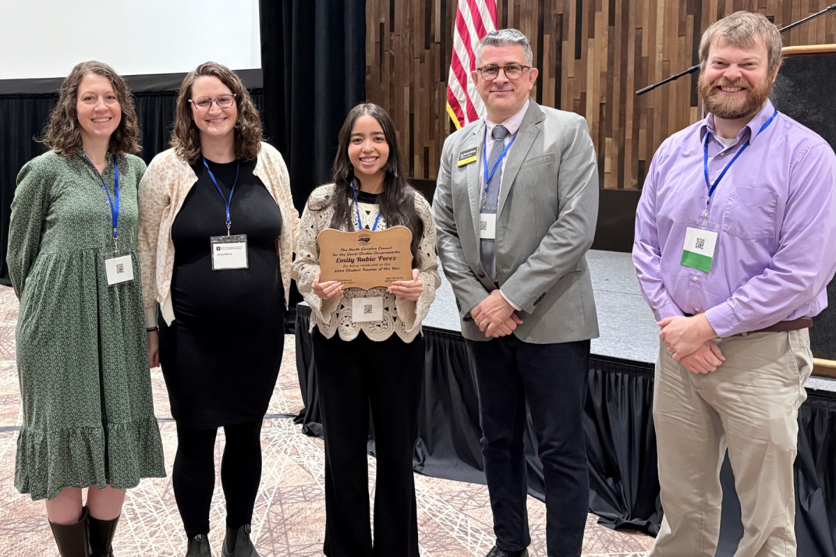 Emily Rubio Pérez ’25 (center) holds her 2026 North Carolina Council for the Social Studies (NCCSS) Student Teacher of the Year plaque, surrounded by History Education program faculty members Dr. Allison Fredette, Jennifer Morris, Dr. Rwany Sibaja, and Dr. Bradley Phillis. Photo courtesy of Dr. Sibaja