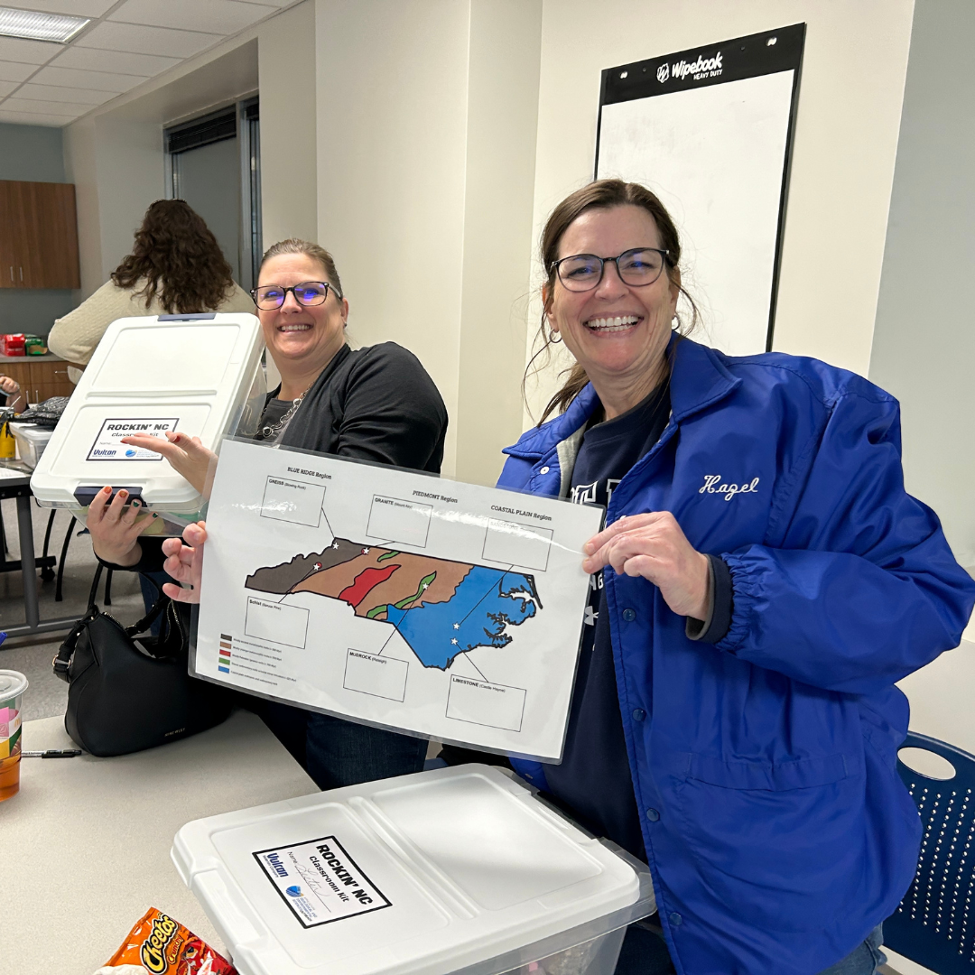 April Smith (left), Content Coach for Iredell-Statesville Schools, and Dr. Debra Lester (right), STEM Coordinator for Iredell-Statesville Schools, show off their Rockin NC' kits.