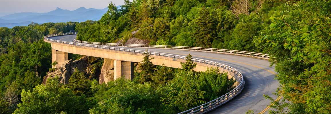 A photograph of the Blue Ridge Parkway at sunset.