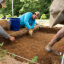 App State student researchers engage in an archaeology field school, using trowels to excavate a layer of soil just beneath the reach of plows at the university’s Blackburn Vannoy Estate and Farm in Ashe County. They discovered an ancient hearth, storage pits, pottery and projectile points made of quartz, quartzite, rhyolite, flint and jasper — evidence that the area was used as a camp by Native American peoples. Pictured are senior anthropology majors Peyton Harrison, of Conover; Cowan Ramirez, of Ashevill