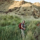 Dr. Sarah Carmichael, professor in the Department of Geological and Environmental Sciences at Appalachian State University, is a geochemist and a National Geographic Explorer. She specializes in Devonian period research, studying the causes and effects of mass extinction events that occurred 350–417 million years ago. She is pictured during a field expedition in Mongolia in 2018, where she and her team evaluated specimens preserved in volcanic rocks. Photo by Felix Kunze