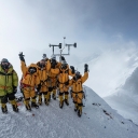 At 8,430 meters above sea level, the high-altitude expedition team celebrates after setting up the world's highest operating automated weather station during National Geographic and Rolex's 2019 Perpetual Planet Extreme Expedition to Mount Everest. Among them is Appalachian’s Dr. Baker Perry. Learn more at www.natgeo.com/everest. Photo by Mark Fisher, National Geographic