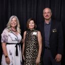 Associate Vice Chancellor of Alumni Engagement Stephanie Billings '92 (left) and College of Arts and Sciences Dean Mike Madritch (right) with Haley Hopper Gentry ‘91, the Chief Executive Officer of Charlotte Douglas International Airport (middle), at the 2025 Alumni Awards Gala on July 12, 2025. Photo by Chase Reynolds