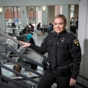 Bryce Helms, a senior criminal justice major and full-time Appalachian police officer, takes a pause from her duties for a photo in the university’s Plemmons Student Union. Photo by Marie Freeman