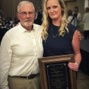 Jenny Reilly receiving the practitioner of the year award, and Dr. Jim Deni who received the liftetime achievement award.