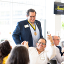 App State senior Juan Pablo “J.P.” Neri stands to be recognized at App State’s 2025 Awards of Distinction ceremony, held April 24 on the Boone campus. Neri’s father, Eduardo, sits in front of him, capturing the moment with a selfie. Neri is a recipient of the 2025 W.H. Plemmons Leadership Medallion. Photo by Kyla Willoughby