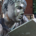 Pictured in fall 2019, an Appalachian State University student walks by an on-campus sculpture depicting a child mid-read. As part of App State’s virtual spring 2021 Hughlene Bostian Frank Visiting Writers Series, three novelists from the Appalachian region — Charles Dodd White, Annette Saunooke Clapsaddle and Carter Sickels — will read from their work and give talks on the craft of writing, and playwright Anna Deavere Smith will give a storytelling presentation. Photo by Marie Freeman