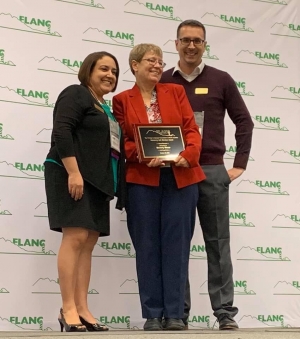 Dr. Beverly Moser, a professor of German at Appalachian State University accepting a Foreign Language Association of N.C. (FLANC) Honorary Life Member award for her long service to foreign language education in the state and in the region. Presented by Delynda Ramirez-Carter, President of FLANC (on the left) and board member and Appalachian alumnus Jeff Pageau ’11 on the right.