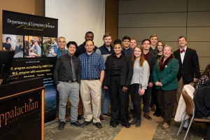The Department of Computer Science graduate and undergraduate students honored at the departmental graduation celebration fall 2018. Front row left to right: Kevin Hu, Eric Cambel, Courtney Dixon, Erin Stein, and Dean Specht Second row left to right: Dr. Tashakkori, Francis Boadu, Braxton Coats, Cristian Gulisano, Chase Costner, Evangeline Luciano, and Owen Dowell Last Row left to right: Sebastian Collins and Jarod Moore.