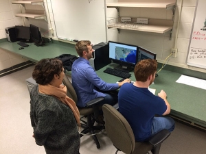 Dr. Jessica Mitchell, assistant professor in Appalachian’s Department of Geography and Planning, oversees Appalachian undergraduate students Darek Olsen, left, and Shane Sosko as they test an online interactive map for visualizing project datasets. Photo courtesy of Jessica Mitchell