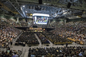 During the College of Arts and Sciences’ commencement ceremony Saturday afternoon, graduates and their families and friends, along with Appalachian faculty, staff and leadership, fill the university’s Holmes Convocation Center. Photo by Marie Freeman