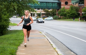Olivia Bargoil, a junior industrial design major from Clayton, jogs along Rivers Street, which bisects Appalachian State University’s campus in Boone. Outdoor exercise, such as jogging, allows individuals to both enjoy the High Country’s many recreation opportunities and remain active during COVID-19, according to Appalachian faculty experts and University Recreation staff. Face coverings are not required while outside as long as the appropriate 6 feet of physical distance can be maintained. Photo by Chase 