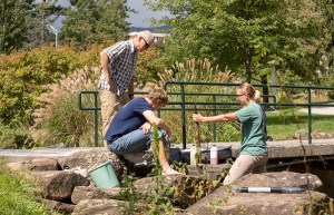 Dr. Shea Tuberty, professor and assistant chair in Appalachian’s Department of Biology, far left, works with biology graduate students Grant Buckner, of Burnsville, center, and Cristina Sanders, of Taylorsville, to check water samples from a creek in Durham Park on campus just before the flooding associated with Hurricane Michael took place. Photo by Marie Freeman