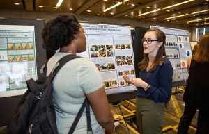 Graduating senior Annie Klyce, from Atlanta, right, who is majoring in geology, presents her poster during the Joint Oceanographic Institutions for Deep Earth Sampling (JOIDES) exhibit at Appalachian’s 2019 STEAM Expo. Photo by Ellen Gwin Burnette