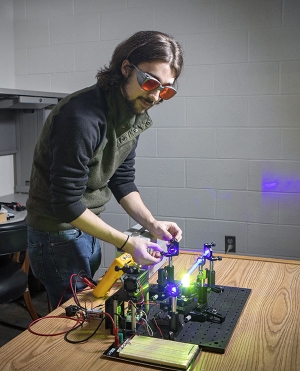 ack Griffin, a senior from Waxhaw majoring in physics at Appalachian, works to develop a demonstration laser. Photo by Marie Freeman