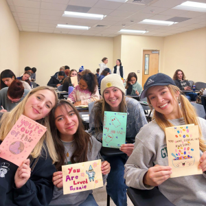 From left, members of Kappa Alpha Pi Fraternity, Inc. Kaylee Taylor, Emma Shelton, Ashley Bigelow and Sofie Mascellino collaborate with Letters of Love to create cards on Nov. 14. Courtesy of McKenna Carver.