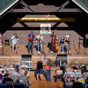 A band competes against more than 100 others in the bluegrass band competition during the 89th Annual Old Fiddler's Convention on Saturday, Aug. 9, 2025, at Felts Park in Galax, Va. Photo by Allison Isley for NPR