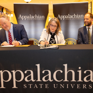 On April 29, App State and Project Kitty Hawk (PKH) signed an agreement that will help remove barriers to educational access and increase career readiness and advancement, particularly for adult learners in North Carolina. App State will launch five online degree programs supported by the project in the 2024–25 academic year. Pictured, from left to right, are PKH Chief Operating Officer David Eby, App State Interim Chancellor Heather Norris and UNC System Executive Vice President and PKH Interim President a