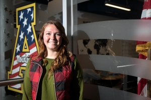 Junior Becca Ryan, age 26, outside Appalachian’s Major General Edward M. Reeder Jr. Student Veteran Resource Center. She took some classes through Coastal Carolina Community College while working at Camp Lejeune, and then enrolled at Appalachian. Photo by Marie Freeman