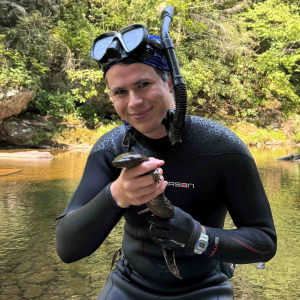 Hellbender researcher and Appalachian State University graduate student Hutch Whitman holds a hellbender. Photograph courtesy Hutch Whitman