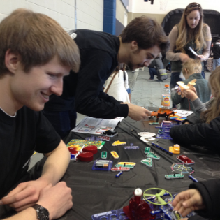 PandA members Jacob Harris and Jack Griffin teach circuit building to elementary school students. Photo submitted.